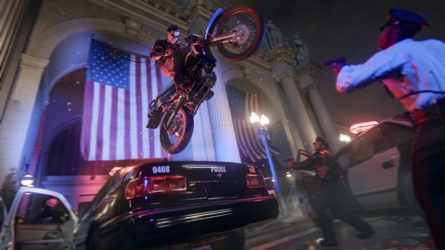 a helmetless man wearing sunglasses at night stunt-jumps over a cop car in front of the U.S. Justice Department building, with a big ole American flag waving in the background, in Call of Duty Black Ops 6