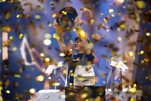 Street Fighter World Cup champion Xiaohai raises the trophy