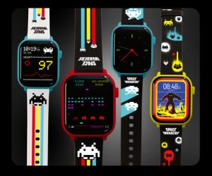 Different retro smart watches next to each other with Space Invaders game on them