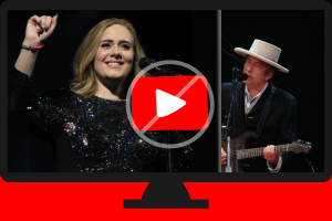 YouTube blocks songs by Adele, Nirvana, Bob Dylan amid SESAC licensing dispute. Adele and Bob Dylan seen performing inside a computer screen with a forbidden sign over a red and white YouTube play button