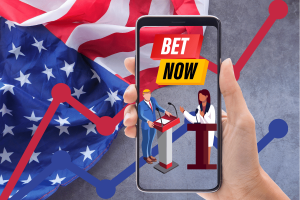  A hand holding a smartphone displays an illustration of two political figures standing at podiums during a debate. The screen shows a 