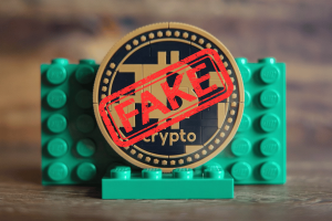 Lego website hacked as fake cryptocurrency scam targets fans with fraudulent coins. Bitcoin made by Lego blocks with fake logo on top