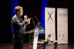 CMAP – Institut DATAIA Data Science Summer School. Yann LeCun stood on stage giving a talk.