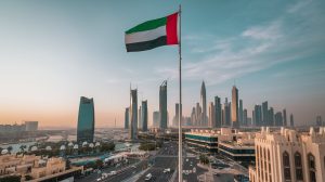 AI-powered UAE cityscape with national flag on display / Aristocrat awarded UAE's first gaming vendor license.