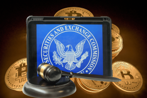 Crypto firms spend $400M battling SEC as Gensler faces growing criticism. Tablet displaying the U.S. Securities and Exchange Commission (SEC) emblem, accompanied by a judge's gavel in the foreground. Bitcoin symbols are visible in the background, symbolizing regulatory challenges in the cryptocurrency industry.