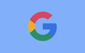 A digital illustration of the Google logo with the UK flag colors (red, white, and blue) instead of the original colors (red, yellow, blue, green, blue, yellow, red). The logo is placed on a light blue background.