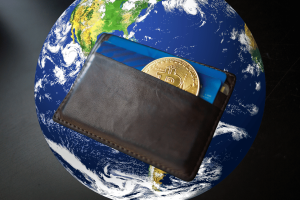 Shift4 launches 'Pay with Crypto,' unveiling its first global payment capabilities. A brown leather wallet holding a Bitcoin coin and a blue credit card appears in the foreground, with a view of Earth in the background, symbolizing global cryptocurrency transactions.