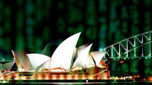 The Sydney Opera house at night with binary code overlaid and out of focus in the foreground