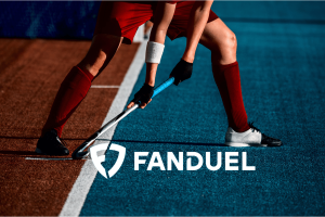 FanDuel partners with Professional Women’s Hockey League as exclusive sportsbook provider. Woman with a hockey stick striking 'FanDuel' logo