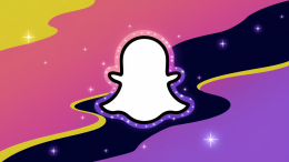 An illustration of the Snapchat ghost icon on a dynamic background. The background is a gradient of pink and purple colors. The ghost icon is made of small stars and is glowing. There are also small stars scattered around the background.