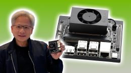 jensen huang from nvidia holding jetson next to big jetson