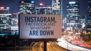 A cinematic shot of a city skyline at night. The buildings are lit up with bright lights. In the foreground, there is a large billboard with the text "Instagram, Facebook and WhatsApp are down". The billboard is situated near a busy road.