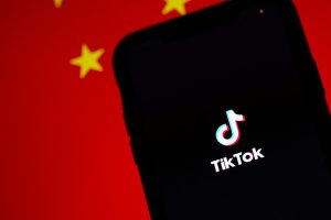 A black screen on TikTok with a Chinese flag in the background