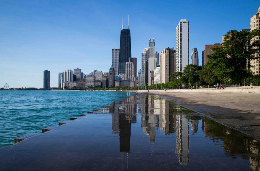 Cityscape image of Chicago, can see the water to the left and buildings in the background.