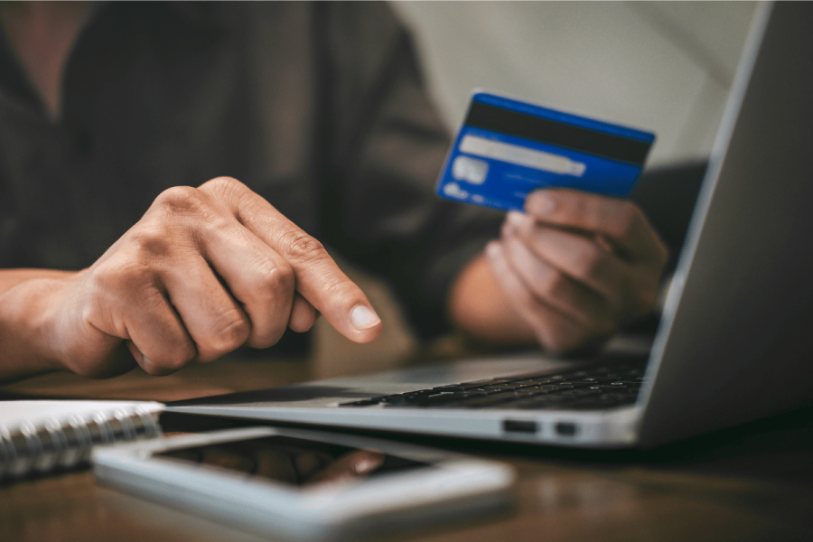 Aspire Global fined $1.8M for 'wholly unacceptable' failure to protect players. Person using a credit card online