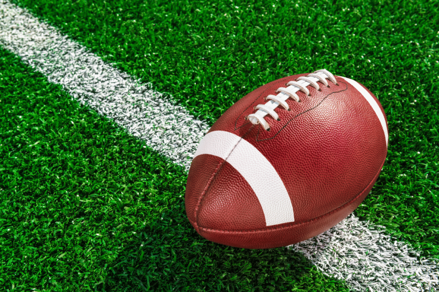 US Congress bill seeks nationwide ban on college athlete prop betting. Stock image of American football on field