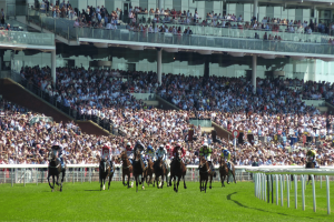 Victorian jockey Lewis German banned 10 years for illegal betting scheme. Image of jockeys on horses racing