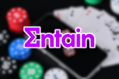 AUSTRAC accuses Entain of failing to stop $152M in suspicious gambling activity. Entain purple logo on top of blurred image of smartphone and gambling memorabilia