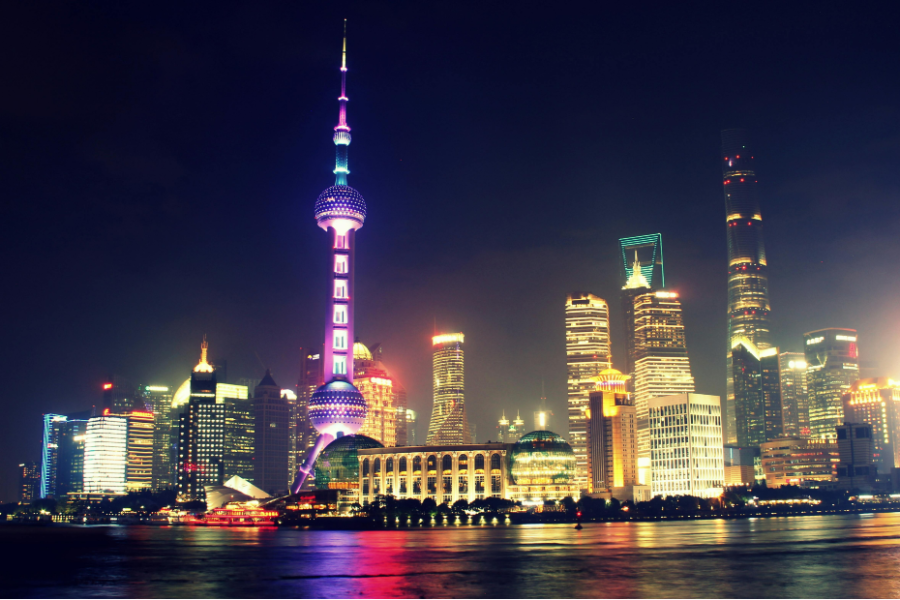 A Chinese city skyline at night lit by neon lights