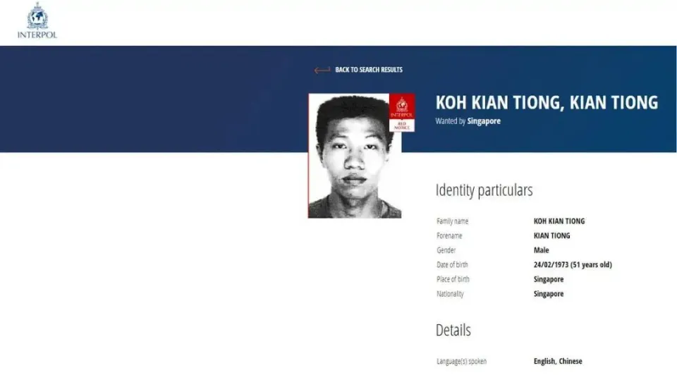 Screenshot of Interpol Red Notice for Koh Kian Tiong, a 51-year-old male from Singapore, showing his photo and identifying details including date of birth, nationality, and languages spoken.