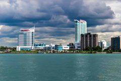 Caesars Windsor from a far away angle, can see the building in the background with the red sign at the top.