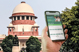 India's Supreme Court to review plea seeking ban on betting and fantasy sports apps. India's Supreme Court building behind person holding smartphone using sports betting app.