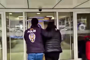 Papara founder arrested in $330M illegal online betting crackdown in Turkey. Man being detained by Turkish police, seen from behind.