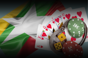 US sanctions Myanmar's Karen National Army over illegal gambling, online scams, and trafficking. Playing cards, poker chips, dice, and handcuffs placed over the Myanmar flag, symbolizing illegal gambling and crime in Myanmar.