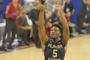Malik Beasley investigation: NBA star accused of gambling-related irregularities. Florida State basketball player wearing jersey number 5 takes a jump shot during a game, with teammates and spectators in the background.