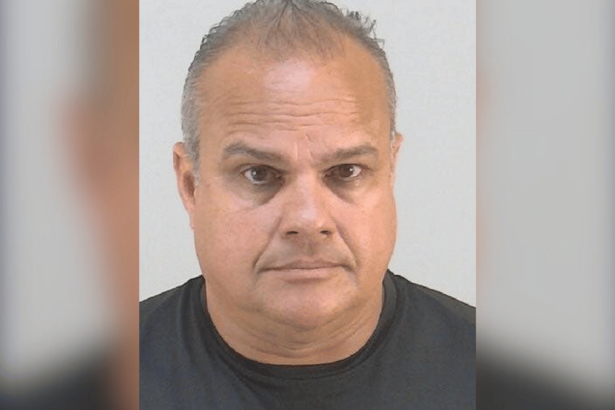Mugshot of former Osceola County Sheriff Marcos Lopez wearing a black shirt, looking directly at the camera.