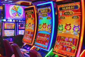 NSW failing on poker machines harm reduction, audit report reveals. Image of poker machines in a venue