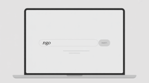 A minimalist search interface on a laptop screen, displaying a clean white background with a prominent search bar spanning the top, inviting user input. The search bar text reads 