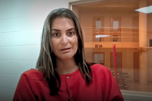 Wife of sheriff Marcos Lopez hit with racketeering charge as $400K bond set. Robin Lynn Severance Lopez appears in a red jail uniform during her first court appearance, speaking via video from a detention facility.