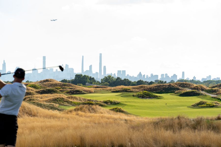 Image of a player at Bally's Ferry Point Golf Links with NYC in the background / Bally’s has moved a step closer to finalizing its plan for a New York casino license.
