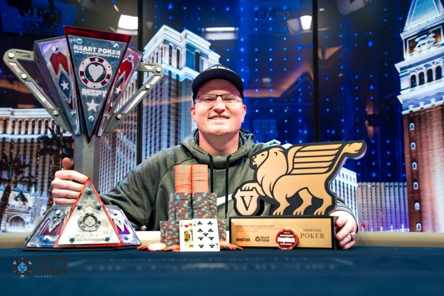 MSPT Hall of Famer Josh Reichard wins the inaugural MSPT Heart Poker Championship / Reichard poses with his trophy, his chips, and his pay cheque.