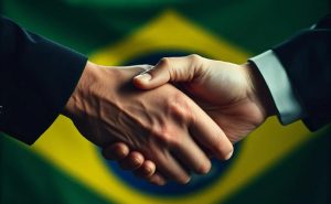 Two hands shaking on a Brazilian background. Brazil regulators ANJL and IBJR join forces to fight illegal betting