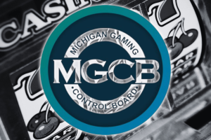 Michigan orders 19 illegal gaming sites to cease operations for licensing violations. Michigan Gaming Control Board logo overlaid on a blurred slot machine background with cherries and sevens visible.