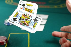 Mavrick bankruptcy files after the debt restructuring. A person plays the paper on a casino table