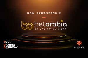 Ygdrasil Partners with Betarabia to launch distinguished holes in Lebanon. YGGDRASIL and Betarabia declares a new partnership with slogans against a dark stage. Read the text: New Partnership, Betarabia by Casino du Liban, Gateway Gaming Gateway, and YGGDRASIL.