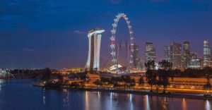 Night time view of Singapore. Singapore issues $21M penalty to 9 financial companies