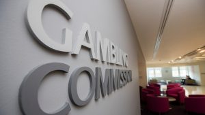 UK Gambling Commission elaborates on incoming reform changes at iGB Live 2025. UK Gambling Commission sign inside building