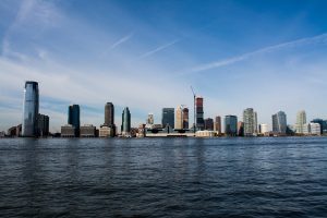 The New Liberty New Jersey Skyline can see the river at the foreground of the image, then the large buildings in the background. Governor Murphy signs the competition of New Jersey prohibiting in law