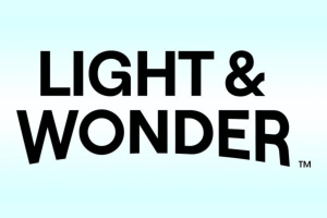 Light & Wonder plans to crush debts with a billion dollars not guaranteed. Light & Wonder Logo on top of the light blue gradient background.