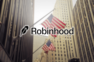 Robinhood soars past Caesars, joining S&P 500 after crypto surge. Robinhood logo with American flags and tall financial district buildings in the background.