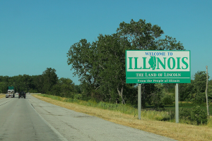 'Welcome to Illinois' sign in green on the side of the road. Illinois issues warning about prediction markets, as it reconfirms its position