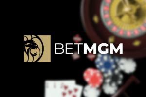 BetMGM partners with BetBlocker to expand responsible gambling efforts and protect players. The BetMGM logo is displayed alongside casino imagery including poker chips, playing cards and a roulette wheel, representing online gambling and gaming.