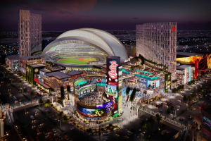 Rendering image of Bally's Corp in Las Vegas, buildings surrounding Bally's sign and stadium in the middle.
