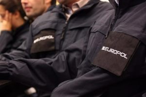 Europol logo on Police uniform. Europol takes action against illegal gambling in Spain and Sweden
