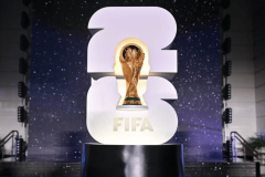 World Cup 2026 draw sets out betting favorites as markets take shape. FIFA World Cup trophy displayed in front of illuminated 2026 logo at the World Cup 2026 draw event.
