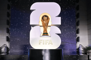 World Cup 2026 draw sets out betting favorites as markets take shape. FIFA World Cup trophy displayed in front of illuminated 2026 logo at the World Cup 2026 draw event.